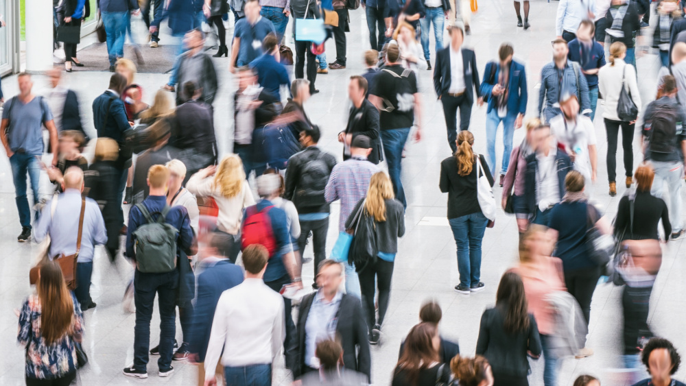 People walking in a busy street of a city.