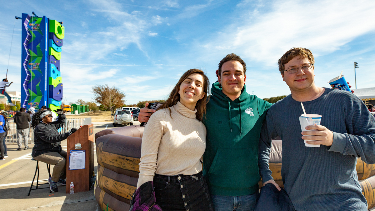 students gathering at a utd fall event