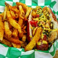 Photo taken at Swizzler Gourmet Hotdogs by Behrad Eats on 8/4/2015