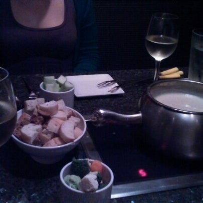 Photo taken at The Melting Pot by Andrew G. on 1/13/2013