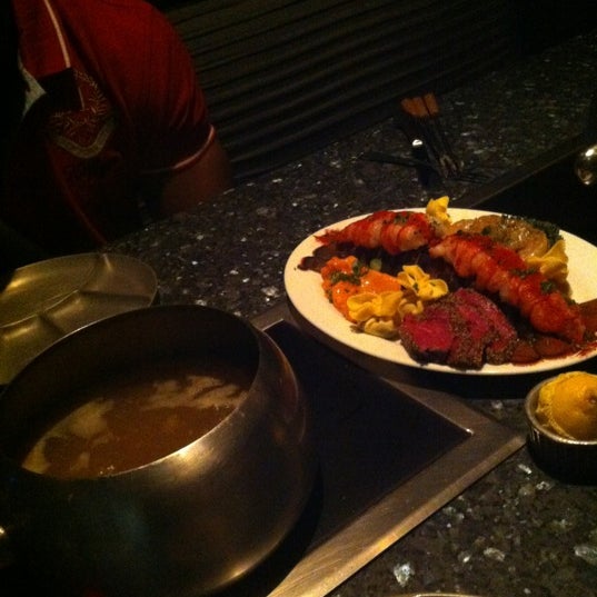 Photo taken at The Melting Pot by Alexandra D. on 4/7/2012