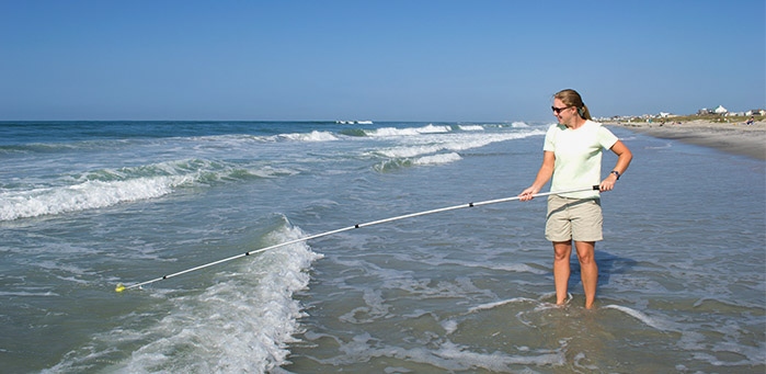 collecting water samples at athe beach