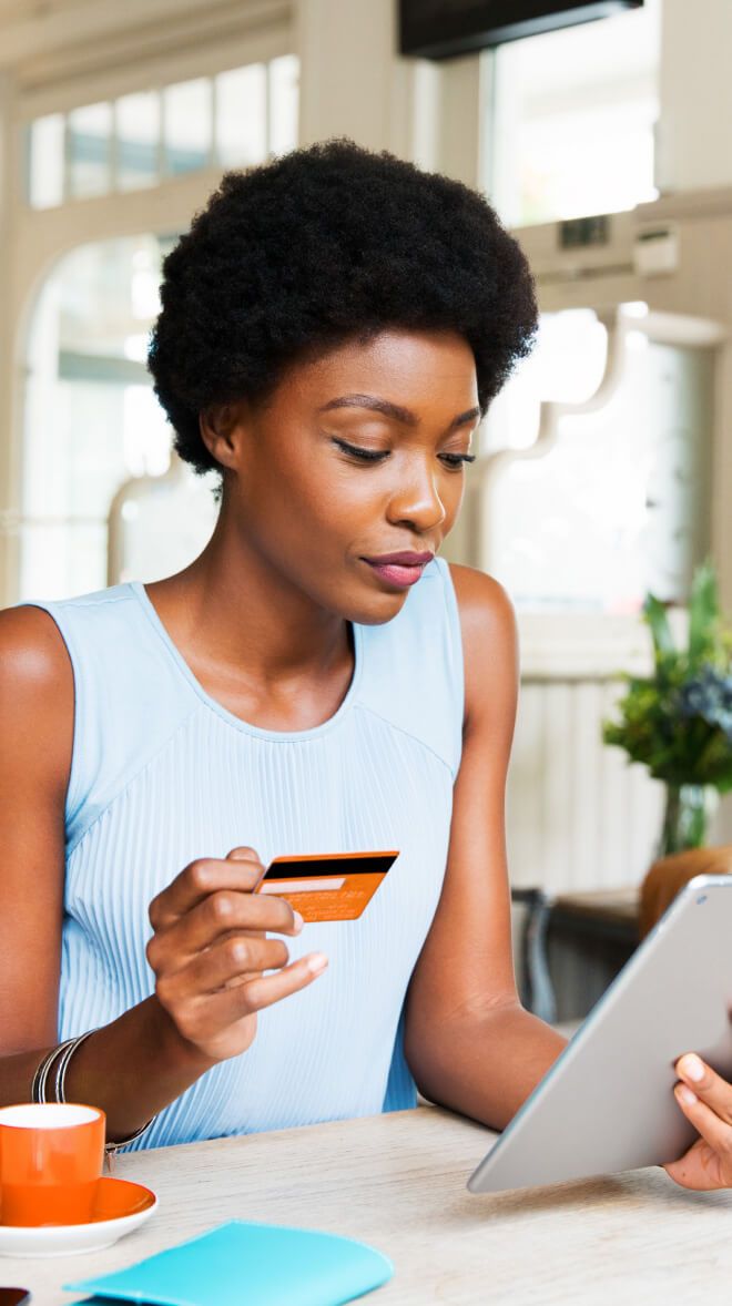 woman holding credit card