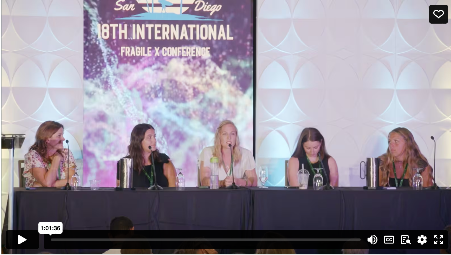 Four fragile x sibling panelists seated at a table