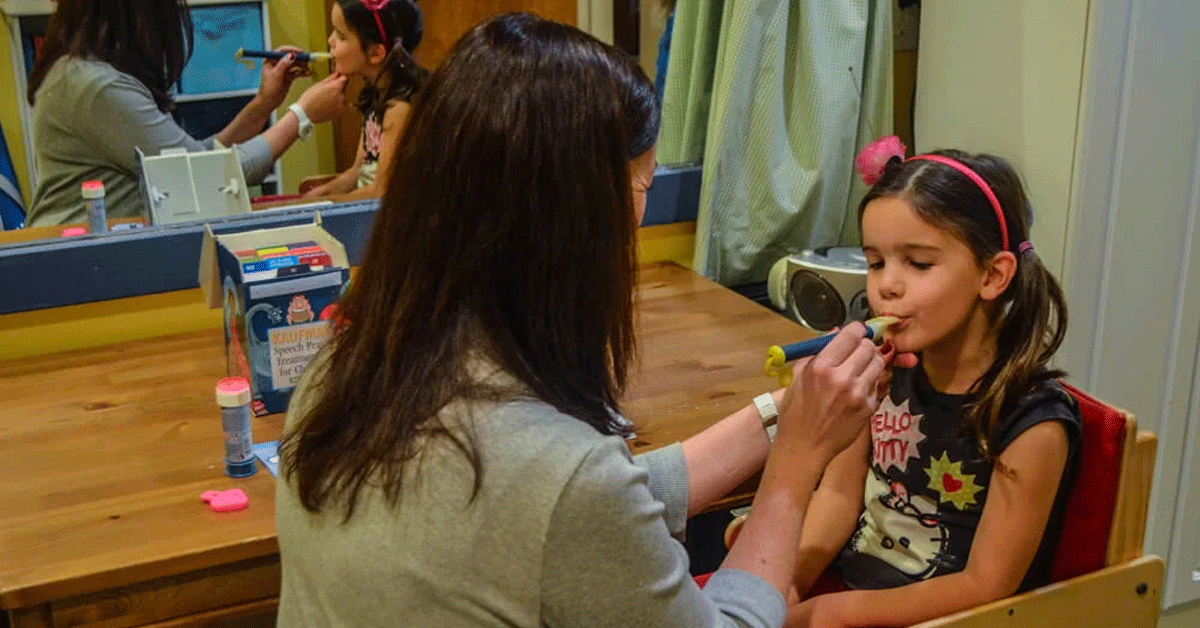 Mom with daughter in a high chair.