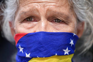 Relatives of imprisoned Venezuelans protest outside the UNICEF headquarters, in Caracas