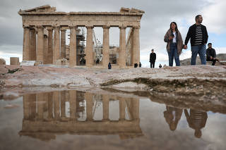 People visit the Ancient Acropolis in Athens and the famous  Parthenon temple