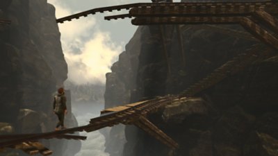 Baby Steps screenshot showing its hero attempting to walk delicately across a rickety wooden bridge atop the mountains 