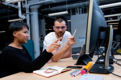 SIE employees collaborating at a desk