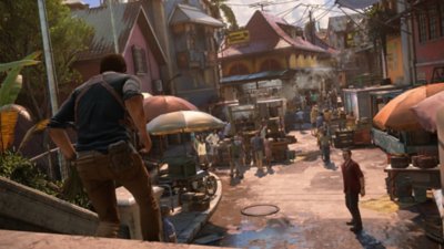 Captura de pantalla de ubicaciones de Uncharted 4 que muestra a Nathan corriendo por unas escaleras en la ciudad de Madagascar