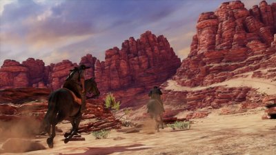 captura de pantalla de uncharted nathan drake collection que muestra a dos personajes a caballo por un cañón de red rock