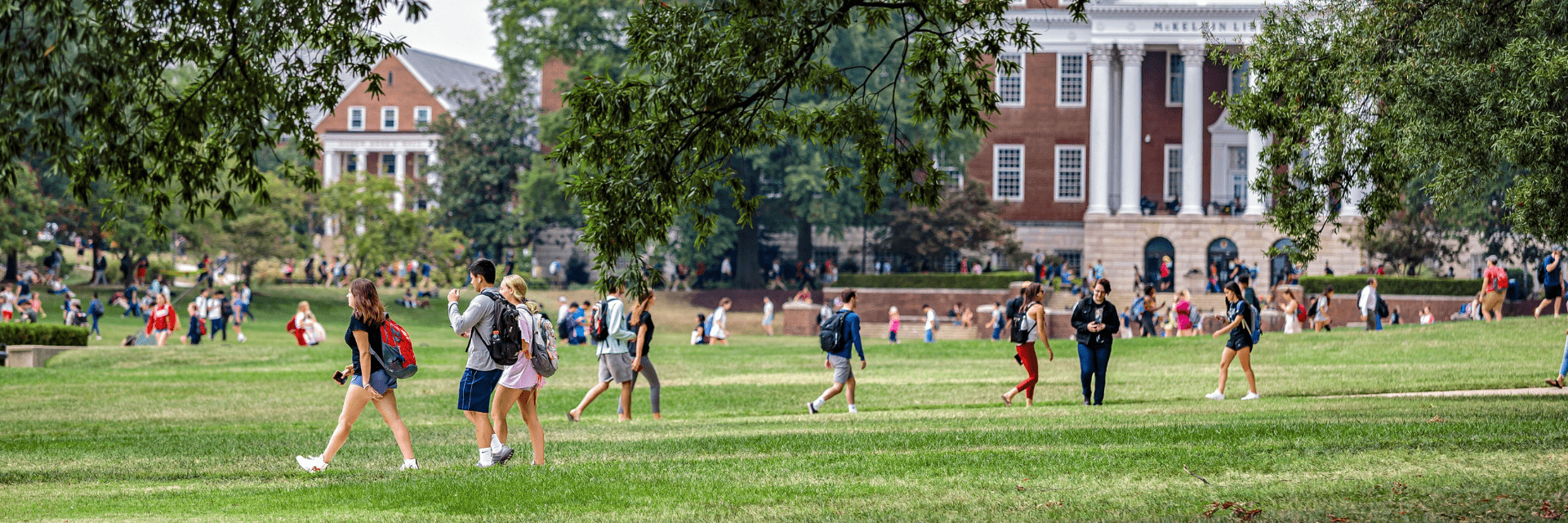 Students walking on lawn