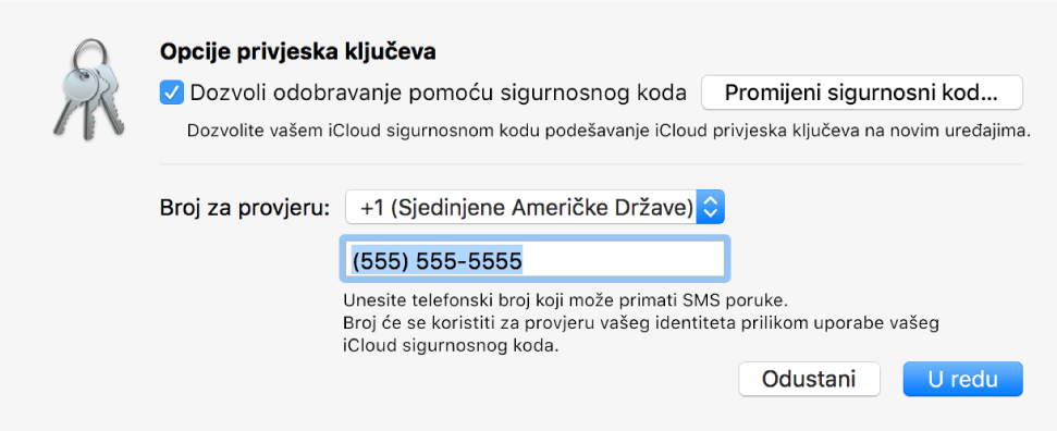 Dijaloški okvir Opcije iCloud privjeska ključeva u kojemu je odabrana opcija za odobrenje sigurnosnim kôdom, s tipkom za promjenu sigurnosnog kôda i poljima za promjenu broja za provjeru.