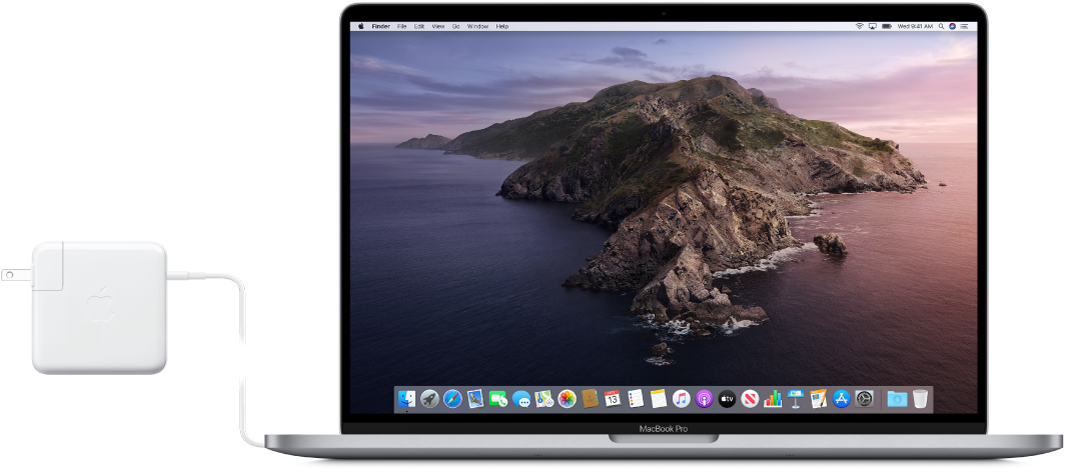 A MacBook Pro with the power adapter attached.