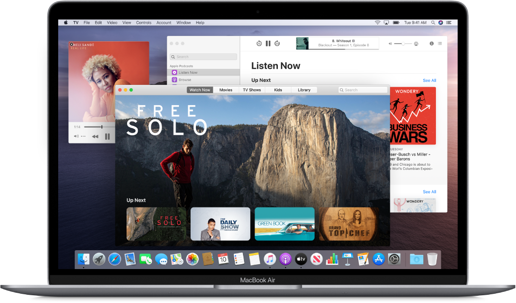 A MacBook Air desktop showing the Music, TV, and Podcasts windows open.