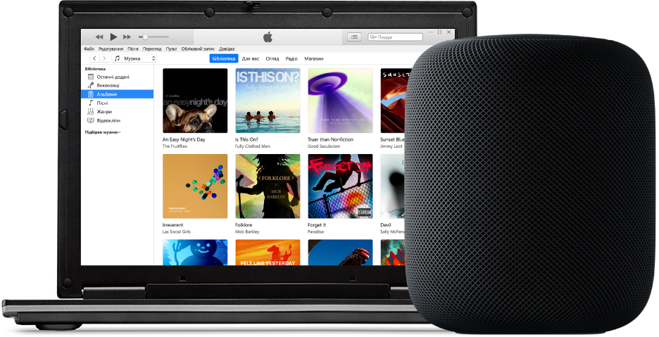 ПК з відкритою програмою iTunes на екрані та HomePod поруч.