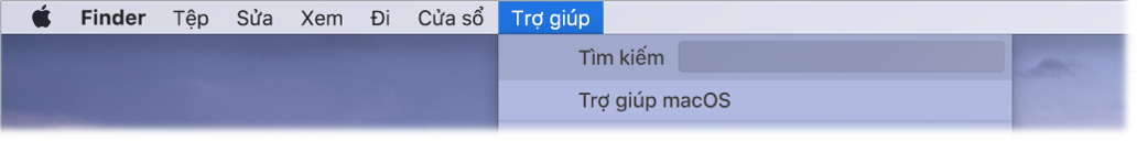 Một phần của màn hình nền với menu Trợ giúp được mở, đang hiển thị các tùy chọn menu cho Tìm kiếm và Trợ giúp macOS.