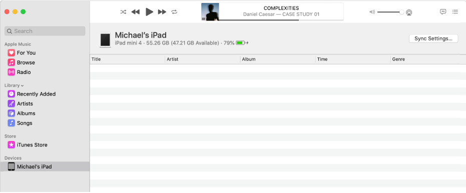 The Music window with a device (Michael’s iPad) in the sidebar. The Sync Settings button in the top-right corner opens the Finder.