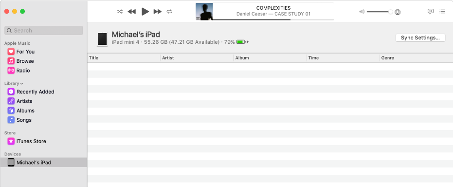 The Music window with a device (Michael’s iPad) in the sidebar. The Sync Settings button in the top-right corner opens the Finder.