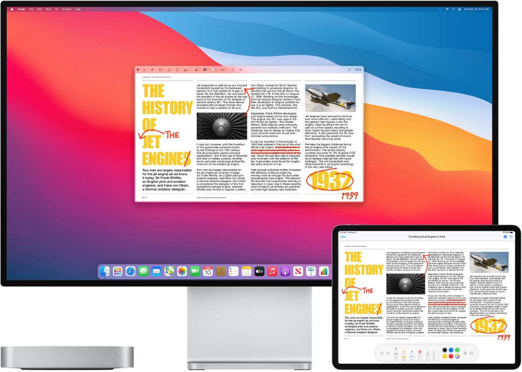 A Mac Mini and an iPad sit side by side. Both screens display an article covered in handwritten red edits, such as crossed out sentences, arrows, and added words. The iPad also has markup controls at the bottom of the screen.