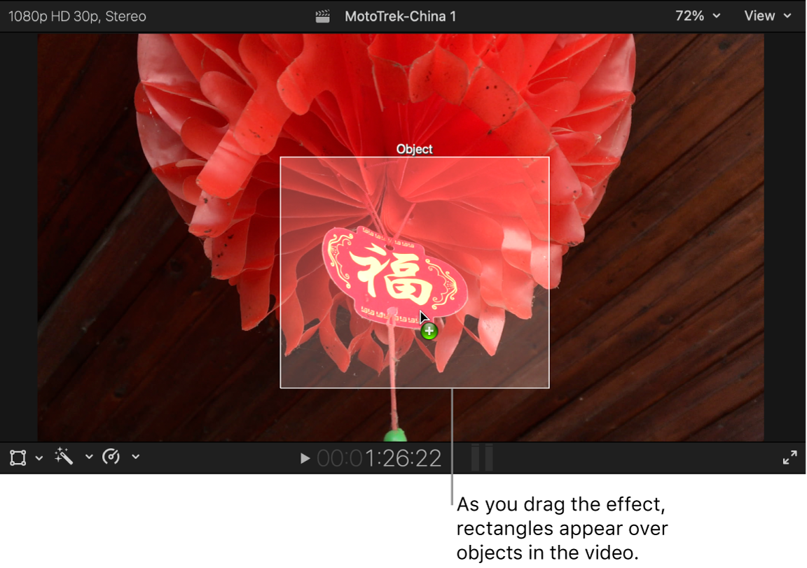 An effect being dragged to the viewer and a white rectangle appearing over an object in the video