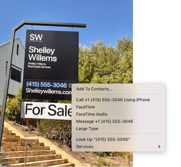 Photo of a Real Estate For Sale sign showing the agent’s phone number selected as Live Text and a menu presenting options to add the phone number to Contacts, call the number, start a FaceTime call, send a text message and more.