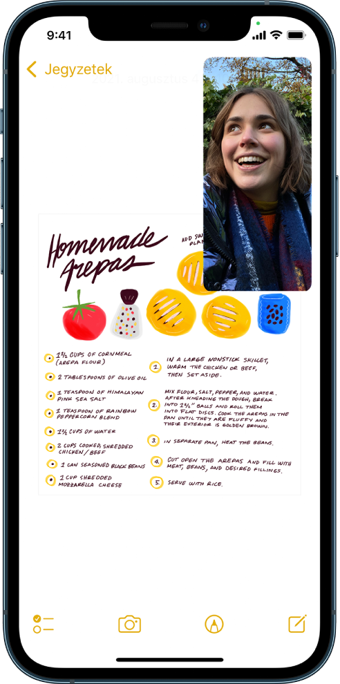 A képernyőn egy folyamatban lévő FaceTime-beszélgetés látható, a képernyő többi részét pedig a Jegyzetek app tölti ki.
