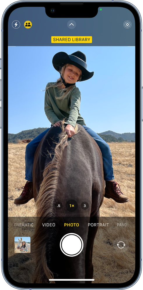 The Camera screen is open and a subject fills the frame. At the top of the Camera screen, the Shared Library button is turned on.