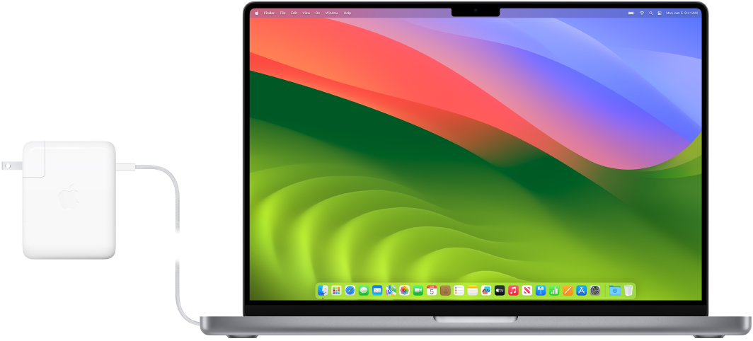 16 colių „MacBook Pro“ su prijungtu maitinimo adapteriu.