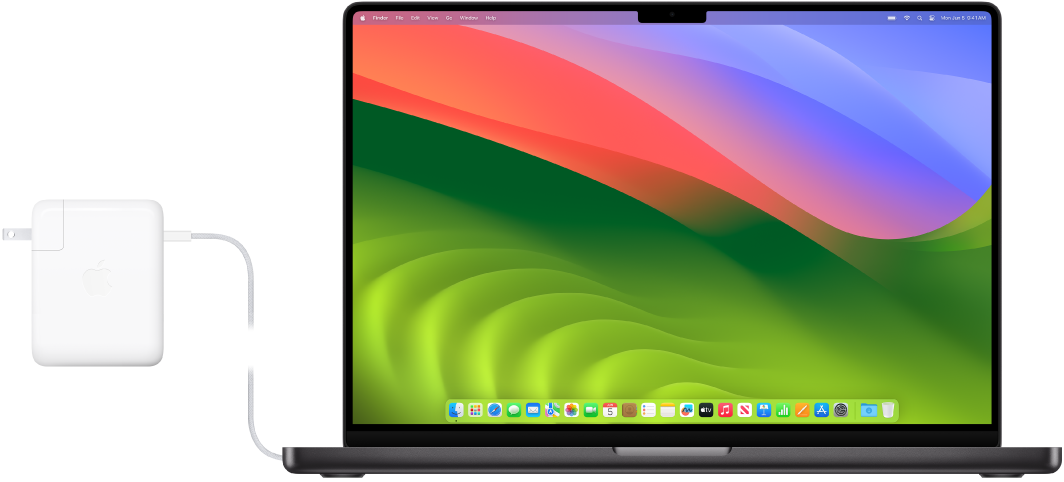 Một MacBook Pro 16 inch với bộ tiếp hợp nguồn được gắn.