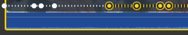 Det filmiske redigeringsværktøj på tidslinjen med automatiske fokuspunkter (hvide prikker) og manuelle fokuspunkter (gule prikker).