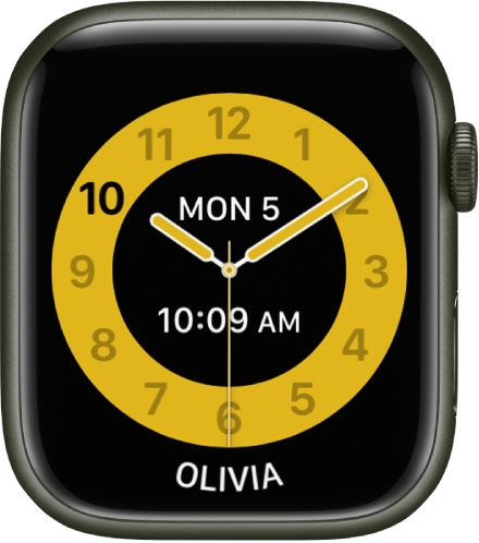 The Schooltime watch face showing an analog clock with the date and digital time near the center. The name of the person who uses the watch is at the bottom.