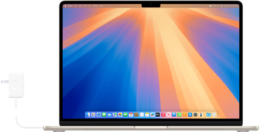 Una MacBook Air con el adaptador de corriente conectado.