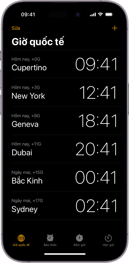 Tab Giờ quốc tế, đang hiển thị thời gian tại nhiều thành phố. Nút Sửa ở gần góc phía trên bên trái cho phép bạn sắp xếp lại hoặc xóa đồng hồ. Nút Thêm ở gần góc phía trên bên phải cho phép bạn thêm nhiều đồng hồ hơn. Các nút Giờ quốc tế, Báo thức, Bấm giờ và Hẹn giờ nằm ở dưới cùng.