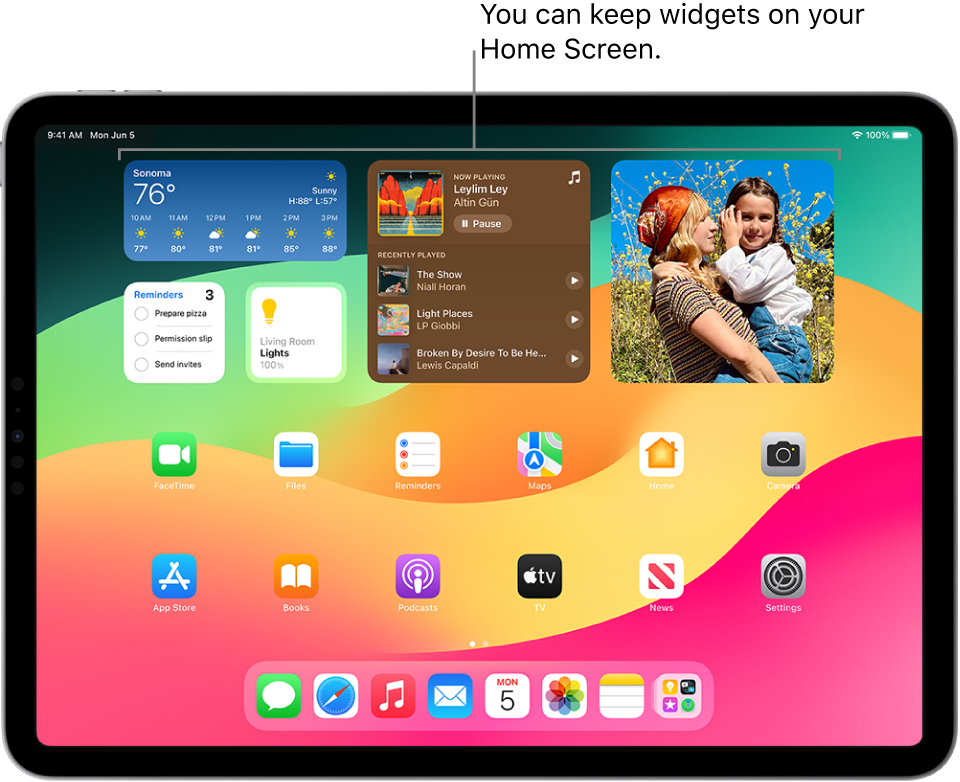 The iPad Home Screen. At the top of the screen are customized widgets for Weather, Music, Photos, Reminders, and Home.