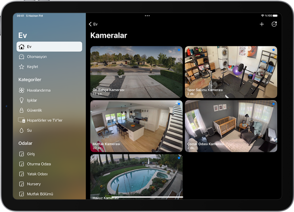 Solda kenar çubuğuyla Ev uygulaması. Ev vurgulanıyor. Sağ tarafta beş güvenlik kamerasından görüntüler var.