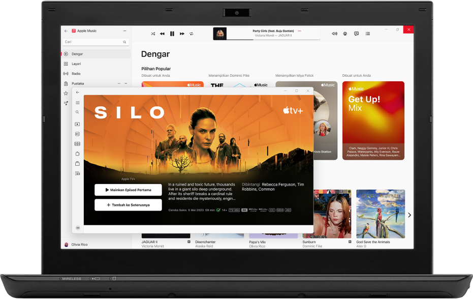 PC dengan app Apple TV dan Apple Music dibuka.