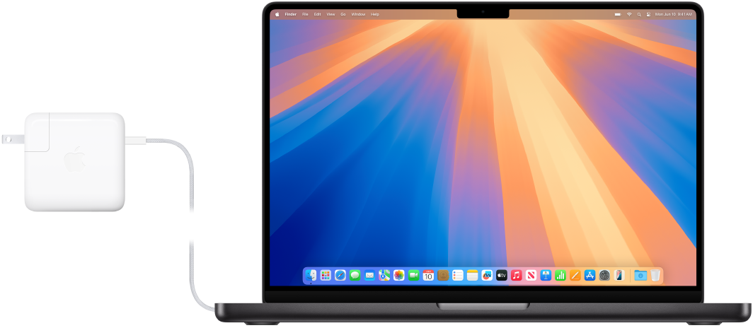 Một MacBook Pro 14 inch với bộ tiếp hợp nguồn được gắn.