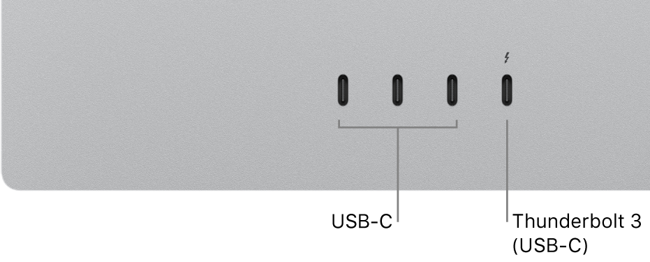 Großaufnahme der Rückseite des Studio Display mit drei USB-C-Anschlüssen links und einem Thunderbolt 3-Anschluss (USB-C) rechts davon.