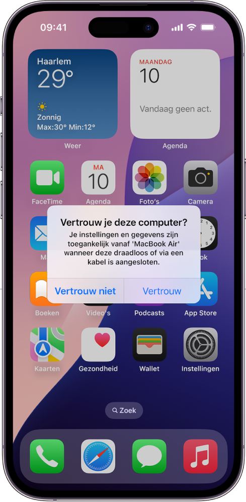 Een iPad met het dialoogvenster 'Vertrouw je deze computer?' als de iPad voor het eerst op een MacBook Air wordt aangesloten.