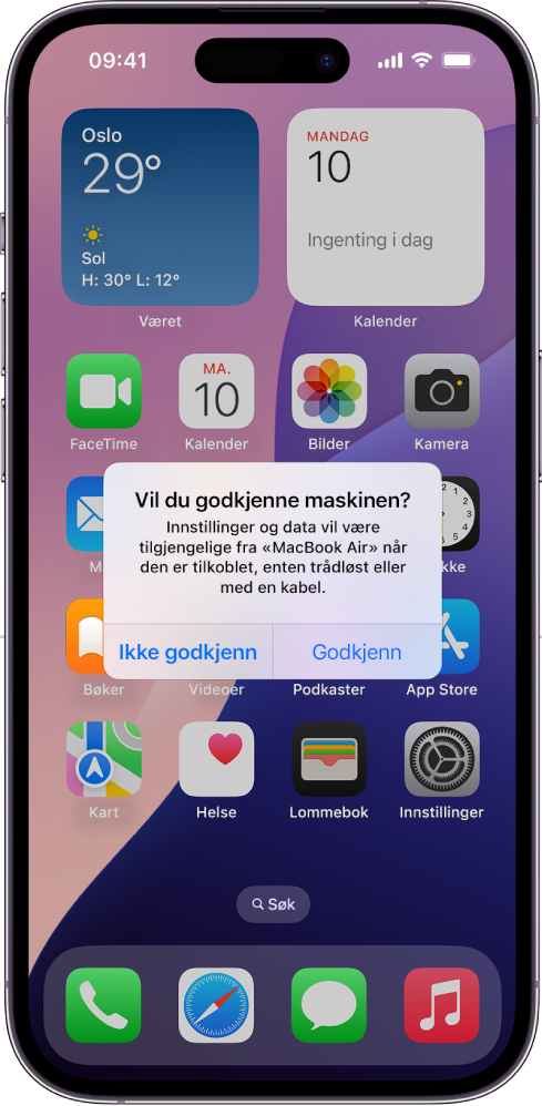 En iPad som viser Vil du godkjenne denne maskinen?-dialogruten dialog når den kobles til en MacBook Air for første gang.