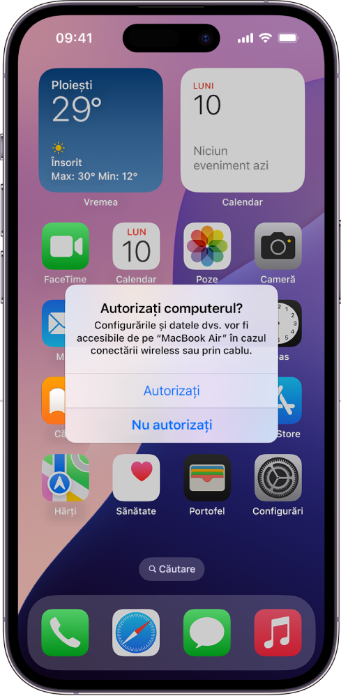 Un iPad pe care se afișează dialogul “Autorizați computerul?” la prima conectare la un MacBook Air.