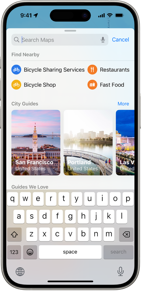 The Maps app showing the search field, categories for nearby services, and city guides. In the bottom part of the screen is the iPhone onscreen keyboard.
