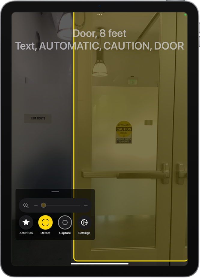 The Magnifier app is open and a door is being detected. A description shows how far away the door is and what the text on the door says.