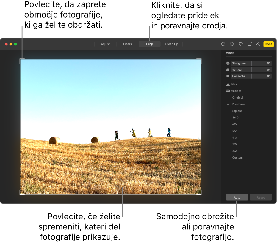 Fotografija v pogledu za urejanje z izbrano možnostjo Obreži v orodni vrstici. Okrog fotografije je pravokotnik za izbor, na desni strani pa so drsniki za poravnavo, možnosti razmerja širina/višina ter gumba Samodejno in Ponastavi.