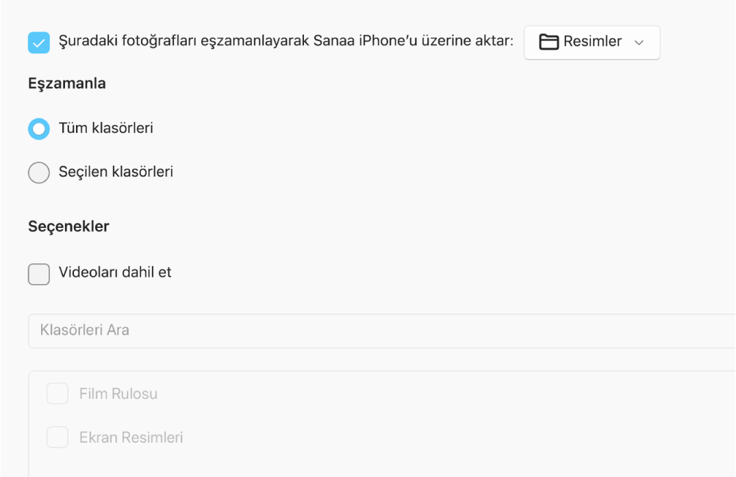 “Tüm fotoğrafları ve albümleri” ve Seçilen albümleri radyo düğmeleri, aşağıdaki “Yalnızca favoriler”, “Videoları dahil et” ve “Şuradaki fotoğrafları otomatik dahil et” onay kutuları ile birlikte görünür.