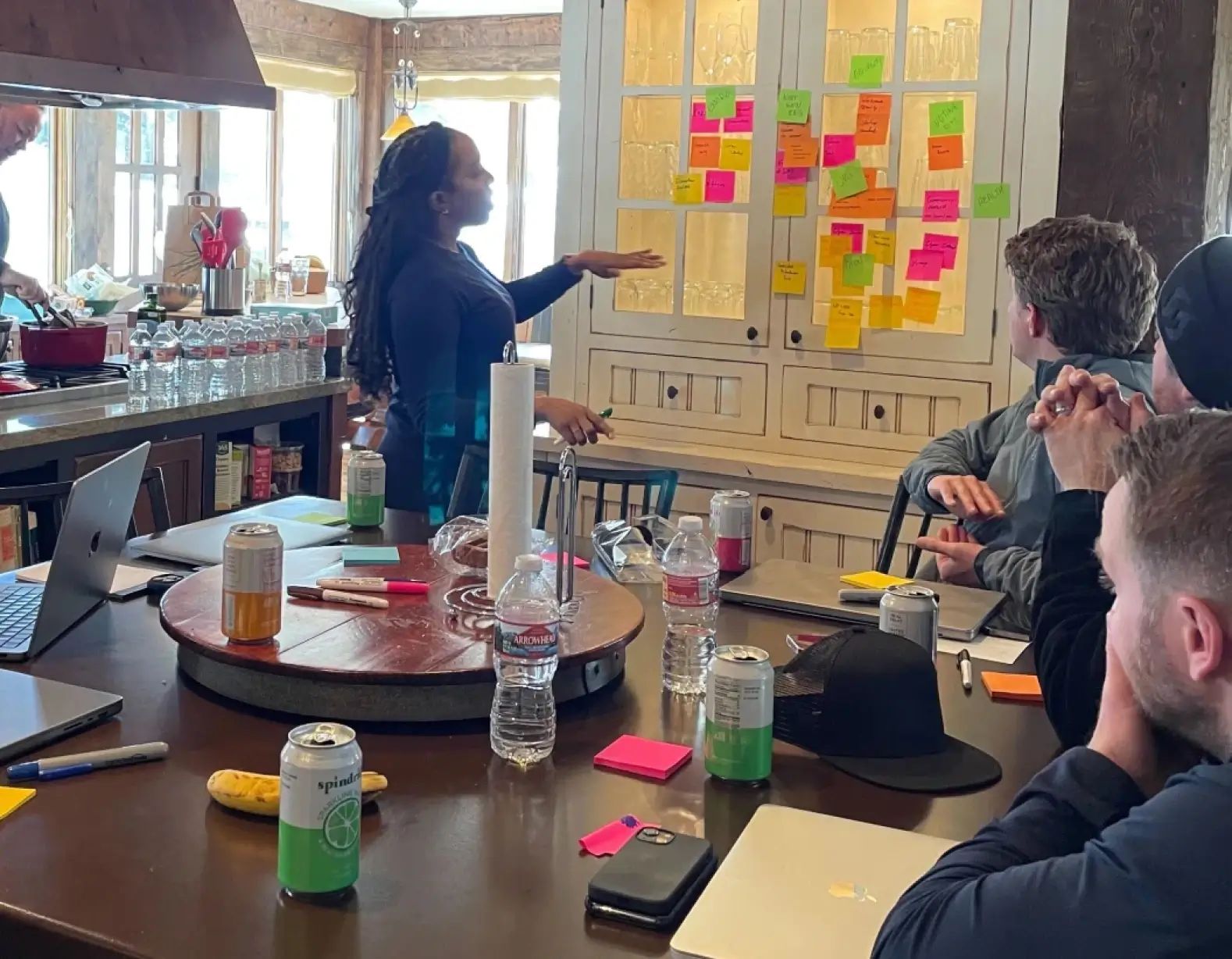 FireHydrant employees working in a conference room strategizing using note cards