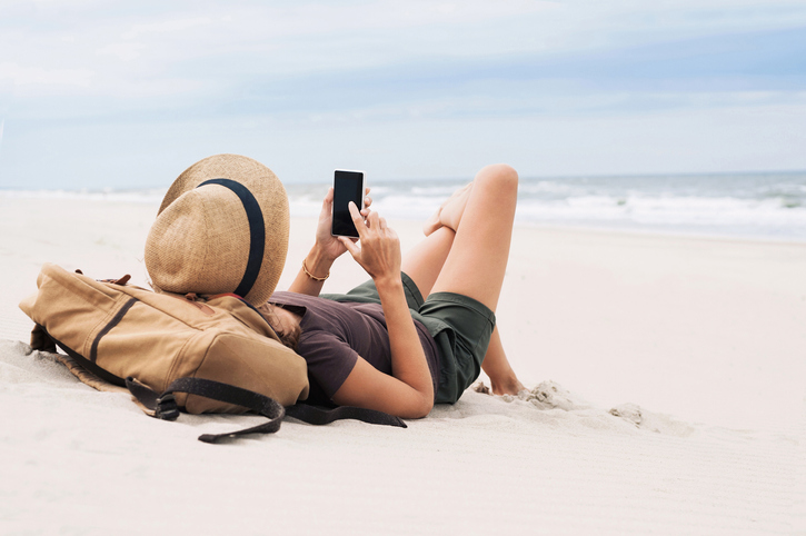 Young woman relaxing on the beach. 