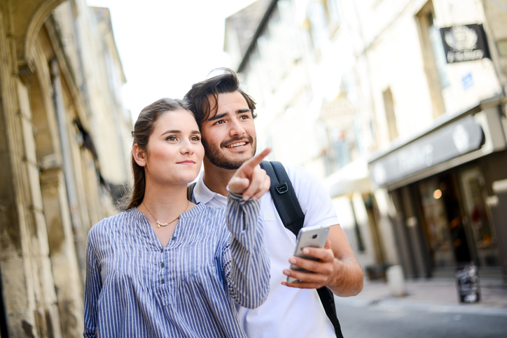 Cute young couple traveling through Europe.