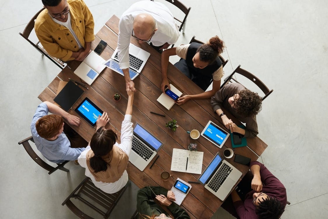 group of employees discussing project management